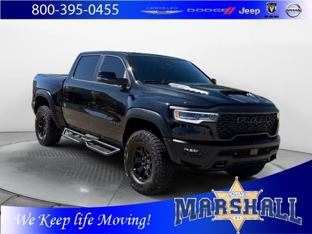 2025 RAM 1500 RHO in Diamond Black Crystal Pearlcoat — front three-quarter view