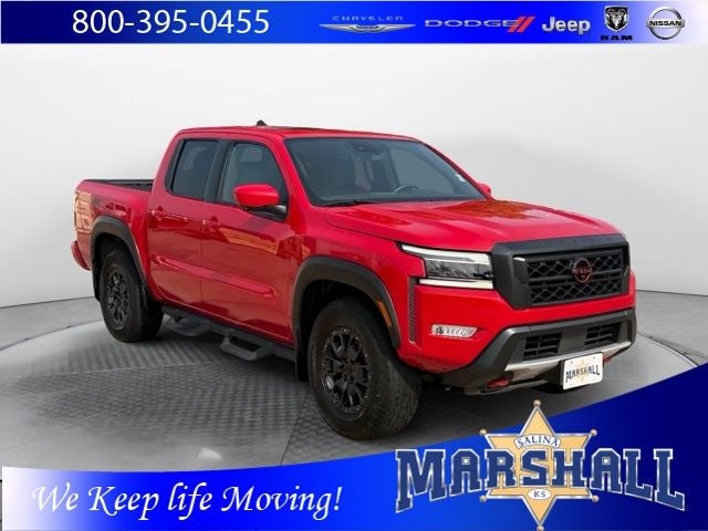 2023 Nissan Frontier PRO-4X in Red Alert — front three-quarter view
