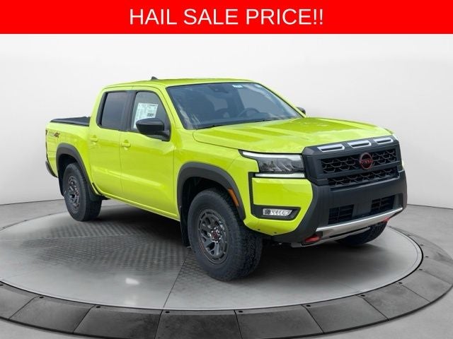 2026 Nissan Frontier PRO-4X in Citrus Strike — front three-quarter view